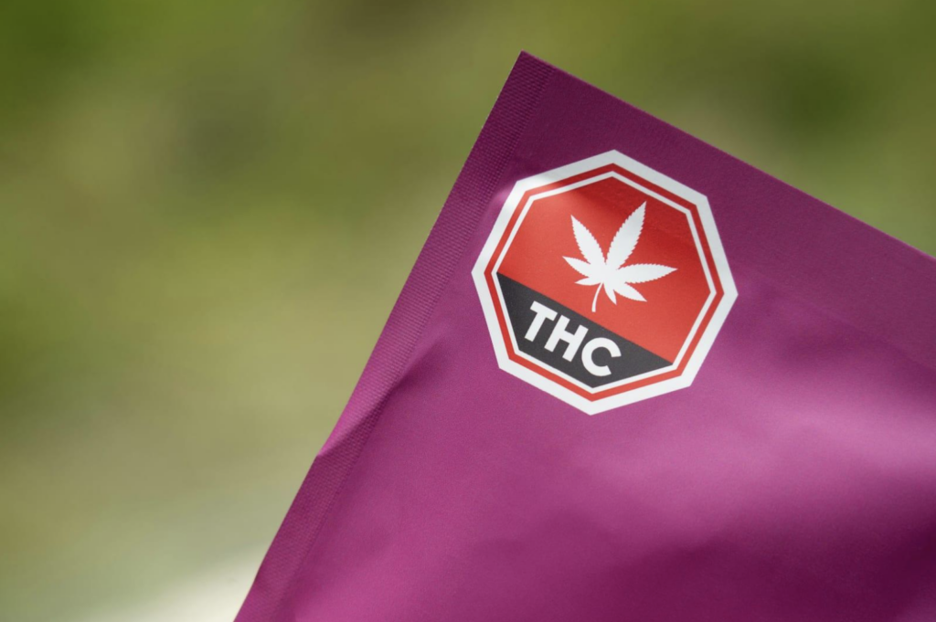 Bag with THC and cannabis leaf
